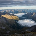 Rugged mountain range with sharp peaks and ridges. Foreground features rocky Royalty Free Stock Photo