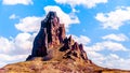 The rugged peaks of El Capitan and Agathla Peak towering over the desert landscape south of Monument Valley Royalty Free Stock Photo