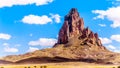 The rugged peaks of El Capitan and Agathla Peak towering over the desert landscape south of Monument Valley Royalty Free Stock Photo