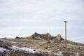 Rugged rock formation jutting out of sage brush covered hillside