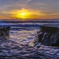 Rugged rocks by the sea in La Jolla at sunset