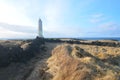 Rugged Rocks and Tall Grass Fields Surrounding Malarrif Lighthouse