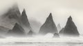 Rugged Sea Stacks Emerging from a Misty Ocean Royalty Free Stock Photo