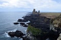 Rugged Seascape with Lava Rock Formation in Iceland