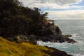 Rugged seaside hill with rocks and trees