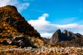 Rugged, stony and rocky mountain landscape in the Lofoten Islands in Norway - the mountain peaks are illuminated Royalty Free Stock Photo