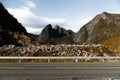 Rugged, stony and rocky mountain landscape in the Lofoten Islands in Norway - the mountain peaks are illuminated Royalty Free Stock Photo