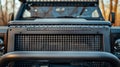 The rugged and toughlooking grille of an offroad vehicle with a gridlike design and protective bars Royalty Free Stock Photo