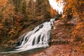 Rugged Waterfalls and River in Forest with Autumn Foliage