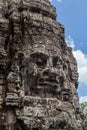 Ruin bayon stone face at gateway of Angkor Wat, Siem Reap, Cambodia. Royalty Free Stock Photo