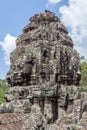 Ruin bayon stone face at gateway of Angkor Wat, Siem Reap, Cambodia. Royalty Free Stock Photo