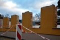 Ruin of a family house behind a plastic security tape barrier. the statically disturbed building is being demolished. reconstructi Royalty Free Stock Photo