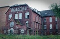 Ruin of a large brick house after a fire in the attic to clarify fire damage Arson theft and vandalism Royalty Free Stock Photo