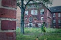 Ruin of a large brick house after a fire in the attic to clarify fire damage Arson theft and vandalism Royalty Free Stock Photo