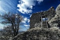 Ruin of the old castle with wooden stairs under the deep blue sky Royalty Free Stock Photo