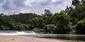 Ruin of old stone house on banks of Ave river in rural Portugal. Royalty Free Stock Photo