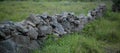 Ruin of old stone wall in rural Portugal. Perspective shot, shallow focus Royalty Free Stock Photo