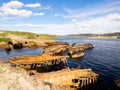 Ruin of old wooden sunken fishing boats in Teriberka, Murmansk Oblast, Russia Royalty Free Stock Photo