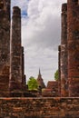 Ruin pillars and pagoda in sukhothai