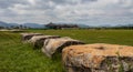 Ruin stones of Hwangnyongsa Temple Site with the History Culture Center in the Background. Gyeongju, South Korea, Asia Royalty Free Stock Photo