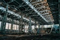 Ruined and abandoned industrial factory warehouse hangar with perspective view Royalty Free Stock Photo