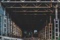 Ruined and abandoned industrial factory warehouse hangar with perspective view Royalty Free Stock Photo