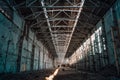 Ruined and abandoned industrial factory warehouse hangar with perspective view Royalty Free Stock Photo