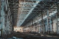 Ruined and abandoned industrial factory warehouse hangar with perspective view Royalty Free Stock Photo