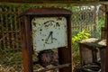 Ruined abandoned old gas station equipment during summer in the lost forgotten village Royalty Free Stock Photo