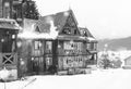 Ruined and abandoned old wooden house in winter Royalty Free Stock Photo