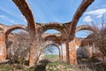 A ruined ancient Christian church made of red brick in summer in the daytime against a blue sky. Royalty Free Stock Photo