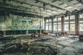 Ruined assembly hall with debris in abandoned Pripyat school