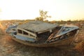 Ruined boat on the land after storm