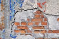 Ruined brick wall made of small mosaics. Finishing the surface of the building with pieces of stone. Intarsia.