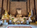 The ruined Buddha image in the temple.
