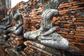 Ruined Buddha statue in the famous place Chaiwatthanaram temple.