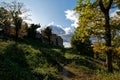 Trail to medieval castle ruin Homburg, fall landscape, sunstar in tree