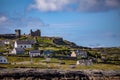 The ruined castle and houses on the island Inis Oirr seen from a ship