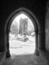 The ruined church of heptonstall through an archway