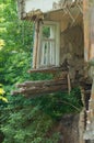 A collapsed floor in the room of a private house, fragment of the wall and window. Destruction of the foundation by groundwater.