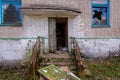 Ruined entrance to an abandoned building from the Soviet era