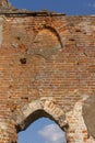 The ruined gothic vault of the old catholic chapel. The ruins of an old church. Brick wall and blue sky