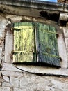 Old green wood window on rock wall in Split Croatia Royalty Free Stock Photo