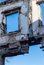 Ruined old house. And the blue sky. The remains of old houses. Abandoned city. The city of ghosts. The ruins of old historic