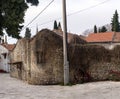 Ruined old stone house with dry ivy covered wall Royalty Free Stock Photo