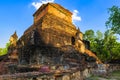 Ruined pagoda and Buddha statue at Sukhothai Historical Park