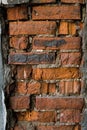 Ruined part of red brick masonry