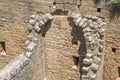 Ruined interior of an ancient medieval castle, part of the half-barrel vault roof