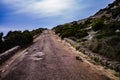 Ruined road along coastline in italy