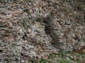 Ruined stone fortress wall with an arch. Royalty Free Stock Photo